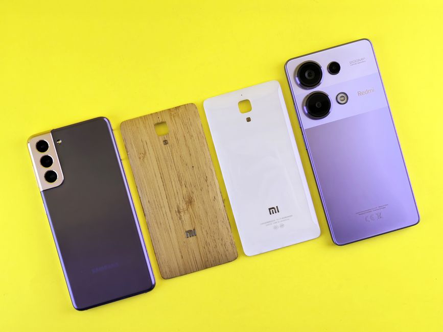 Different smartphone back covers displayed on a vibrant surface showing the variety of design options available for custom phone cases