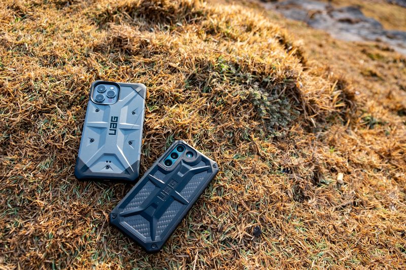 Close-up comparison of different phone case materials showing texture and build quality differences between TPU, silicone, and polycarbonate